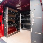 NS rear van side angle view of the Kia PV5 Cargo Double Rear and Bulkhead Hexaboard Van Racking