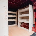 OS rear van side angle view of the Kia PV5 Cargo Double Rear and Bulkhead Van Racking