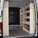 OS side view of the MAN TGE 2017- MWB NS Rear and Driver Side Racking with Toolbox Shelves