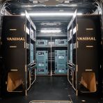 Rear van view of the Kia PV5 Cargo Makita Makpac Toolbox Compatible Van Racking (x3 V1) displayed with Makita toolboxes and top trays