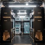 Rear van view of the Kia PV5 Cargo Makita Makpac Trolley Compatible Van Racking (x3 V1) displayed with Milwaukee toolboxes and trolley