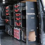 Rear van side angle view of the Kia PV5 Cargo Milwaukee Packout Trolley Compatible Van Racking (Full OS) displayed with Milwaukee toolboxes and trolley