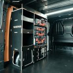 Rear van NS angle view of the Kia PV5 Cargo Milwaukee Packout Toolbox Compatible Van Racking - NS Rear displayed with Milwaukee toolboxes and top tray