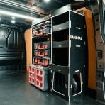 Rear van OS angle view of the Kia PV5 Cargo Milwaukee Packout Toolbox Compatible Van Racking - OS Rear displayed with top tray