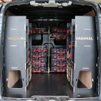 Rear van view of the Kia PV5 Cargo Milwaukee Packout Toolbox Compatible Van Racking (x3 V1) displayed with Milwaukee toolboxes