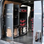 Rear van NS angle view of the Kia PV5 Cargo Milwaukee Packout Toolbox Compatible Van Racking (x3 V1) displayed with Milwaukee toolboxes