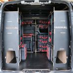 Rear van view of the Kia PV5 Cargo Milwaukee Packout Trolley Compatible Van Racking (x3 V1) displayed with Milwaukee toolboxes, trolley and top trays