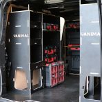 Rear van NS angle view of the Kia PV5 Cargo Milwaukee Packout Trolley Compatible Van Racking (x3 V1) displayed with Milwaukee toolboxes, trolley and top trays