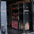 Rear van OS angle view of the Kia PV5 Cargo Milwaukee Packout Trolley Compatible Van Racking (x3 V1) displayed with Milwaukee toolboxes and trolley