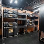 Side van view of the Kia PV5 Cargo DeWalt ToughSystem Toolbox Compatible Van Racking (x3 V2) displayed with DeWalt ToughSystem toolboxes