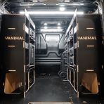 Rear van view of the Kia PV5 Cargo DeWalt ToughSystem Trolley Compatible Van Racking (x3 V2) displayed with DeWalt ToughSystem toolboxes, trolley and top trays