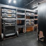 Side van angle view of the Kia PV5 Cargo DeWalt ToughSystem Trolley Compatible Van Racking (x3 V2) displayed with DeWalt ToughSystem toolboxes, trolley and top trays