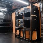 Rear van side angle view of the Kia PV5 Cargo DeWalt ToughSystem Toolbox Compatible Van Racking - OS Rear displayed with DeWalt ToughSystem toolboxes