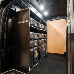 Side van view of the bulkhead section of the Kia PV5 Cargo DeWalt ToughSystem Toolbox Compatible Van Racking (x3 V1) displayed with DeWalt ToughSystem toolboxes and top tray