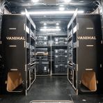 Rear van view of the Kia PV5 Cargo 2025- DeWalt TSTAK Trolley Compatible Van Racking (x3 V1) displayed with DeWalt TSTAK toolboxes and top trays
