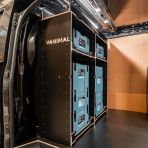 Side van view of the Kia PV5 Cargo Makita Makpac Toolbox Compatible Van Racking - Bulkhead displayed with Makita toolboxes and top tray