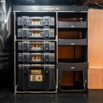Side van view of the Kia PV5 Cargo DeWalt ToughSystem Toolbox Compatible Van Racking - Front displayed with DeWalt ToughSystem toolboxes and top tray