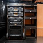 Side van view of the Kia PV5 Cargo DeWalt ToughSystem Trolley Compatible Van Racking - Front displayed with DeWalt ToughSystem toolboxes, trolley and top tray