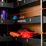 Close-up view of the bulkhead and front RH L-rack displaying equipment, tools and boxes 
