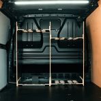 Rear van view of the Kia PV5 Cargo Milwaukee Packout Trolley Compatible Van Racking - Bulkhead