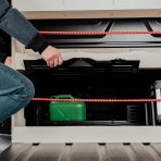 Access hatch for under seat storage is still accessible without restriction