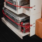 Close-up view of the bottom of the Front Predator Storage Box (x3) Ply Racking System for the Transit Custom 2023- 