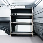 Driver side van view of the Proace City Long Double Front Toolbox Shelving Hexaboard Van Racking - sliding door displayed open