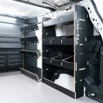 Rear van side angle view of the Proace City Long OS Hexaboard Van Racking: Compartment + Side Load Toolbox Shelves - sliding door displayed open 
