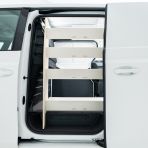 Passenger side view of the VW ID Buzz Cargo NS Van Racking: Rear Compartment & Front Toolbox Shelves
