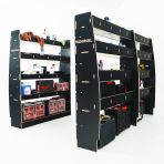 RH side angle view of the MAN TGE 2017- MWB Hexaboard Triple Van Racking System (Multi-Compartment) displayed with tools and toolboxes