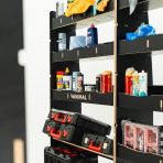 Close-up view of the racking compartments and shelfs with tools and equipment