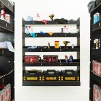 Close-up rear van view of the MAN TGE 2017- MWB Hexaboard Double Rear and Full-Width Bulkhead Van Racking System displayed with tools and toolboxes