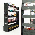 Close-up side angle van view of the MAN TGE 2017- MWB Hexaboard Double Rear and Full-Width Bulkhead Van Racking System displayed with tools and toolboxes