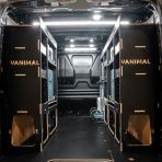 Rear van view of the Kia PV5 Cargo Makita Makpac Trolley Compatible Van Racking (x3 V2) displayed with Makita toolboxes, trolley and top trays