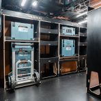 Side van angle view of the Kia PV5 Cargo Makita Makpac Trolley Compatible Van Racking (x3 V2) displayed with Makita toolboxes, trolley and top trays