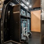 Side van view of the bulkhead section of the Kia PV5 Cargo Makita Makpac Trolley Compatible Van Racking (x3 V1) displayed with Milwaukee toolboxes, trolley and top tray