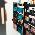 Close-up view of the racking compartments and shelves displayed with tools and equipment 