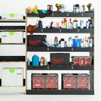 Close-up side van view of the rear section of the Nissan Interstar 2025-  Hexaboard Driver Side Van Racking with x5 Festool Systainer Shelves displayed with tools and toolboxes