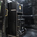 Side van angle view of the VW Crafter 2017+ DeWalt ToughSystem 2.0 Trolley Compatible Van Racking - Bulkhead displayed with DeWalt ToughSystem 2.0 toolboxes and trolley