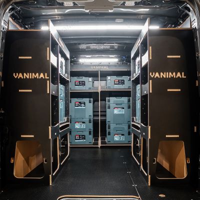 Rear van view of the Kia PV5 Cargo Makita Makpac Toolbox Compatible Van Racking (x3 V1) displayed with Makita toolboxes and top trays