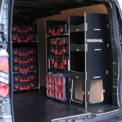 Rear van OS angle view of the Kia PV5 Cargo Milwaukee Packout Trolley Compatible Van Racking (x2 V2) displayed with Milwaukee toolboxes and trolley