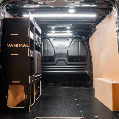Rear van view of the Kia PV5 Cargo DeWalt ToughSystem Toolbox Compatible Van Racking - NS Rear displayed with DeWalt ToughSystem toolboxes and top tray