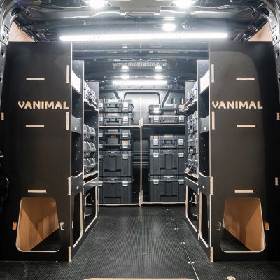 Rear van view of the Kia PV5 Cargo DeWalt TSTAK Toolbox Compatible Van Racking (x3 V1) displayed with DeWalt TSTAK toolboxes