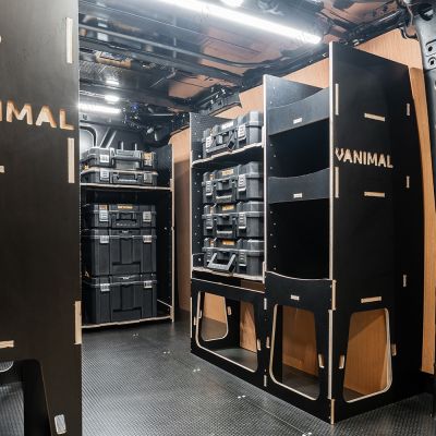 Rear van OS angle view of the Kia PV5 Cargo 2025- DeWalt TSTAK Trolley Compatible Van Racking (x3 V1) displayed with DeWalt TSTAK toolboxes