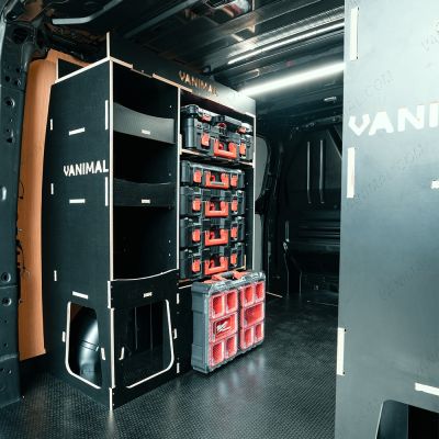 Rear van OS side angle view of the Transit Custom 2023+ LWB Hexaboard Milwaukee PackOut Double Rear Racking - displayed with Milwaukee tools