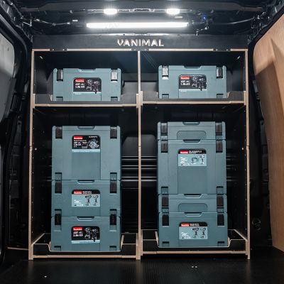 Rear van view of the Kia PV5 Cargo Makita Makpac Toolbox Compatible Van Racking - Bulkhead displayed with Makita toolboxes and top tray