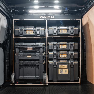 Rear van view of the Kia PV5 Cargo DeWalt ToughSystem Trolley Compatible Van Racking - Bulkhead displayed with DeWalt ToughSystem toolboxes, trolley and top tray