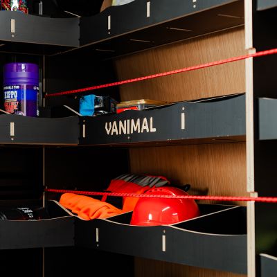 Close-up view of the bulkhead and front RH L-rack displaying equipment, tools and boxes 
