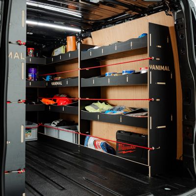 OS side view of the Ford Transit Custom SWB 2023-2023 Hexaboard Complete Full Van Racking Solution displaying equipment, tools and boxes 