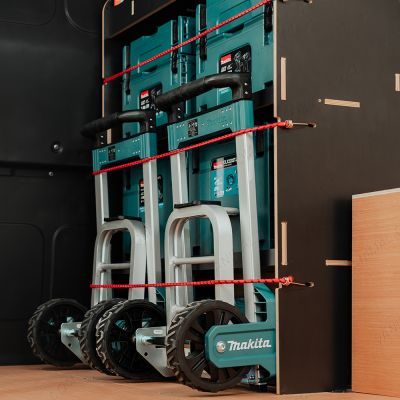 Close-up side angle view of the Fiat Scudo Hexaboard OS Front MakPac/Toolbox Van Racking displayed with Makita toolboxes and trolleys